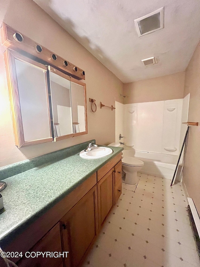 full bathroom with shower / washtub combination, vanity, and toilet