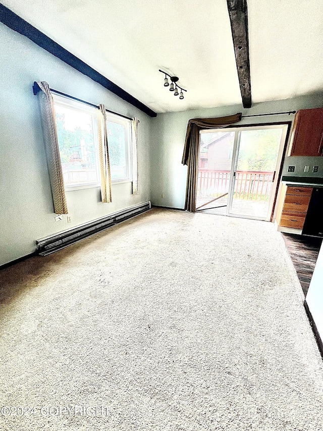 unfurnished living room featuring a baseboard radiator and rail lighting