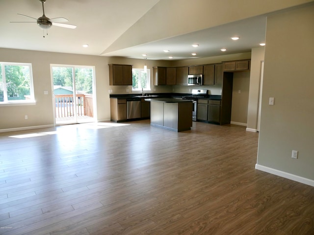 L7 Harman Loop, Wasilla, AK 99654 - kitchen featuring appliances with stainless steel finishes, ceiling fan, a kitchen island, dark hardwood / wood-style flooring, and lofted ceiling