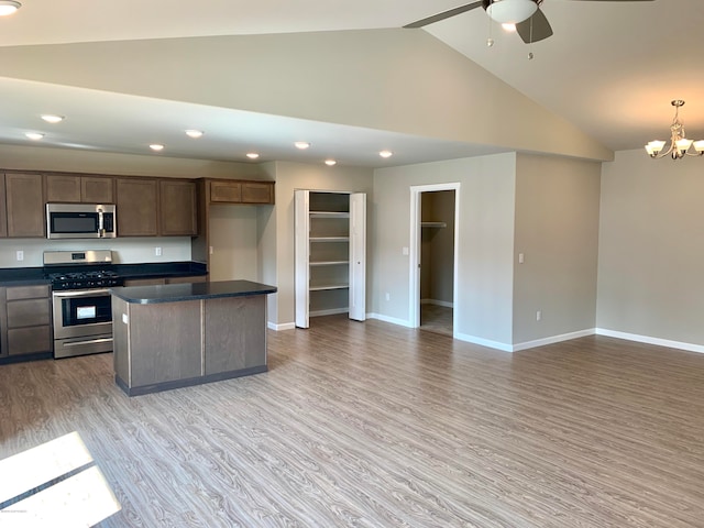 L7 Harman Loop, Wasilla, AK 99654 - kitchen with decorative light fixtures, ceiling fan with notable chandelier, hardwood / wood-style flooring, stainless steel appliances, and a kitchen island