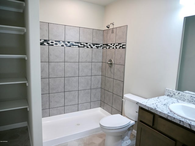 L7 Harman Loop, Wasilla, AK 99654 - bathroom with tile flooring, tiled shower, toilet, and large vanity