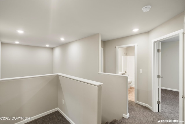 hallway featuring carpet floors