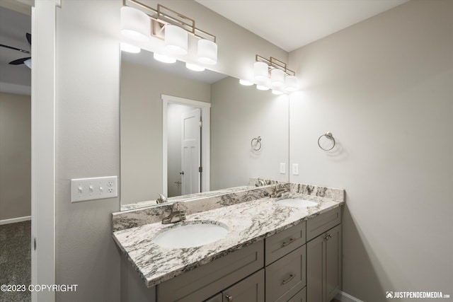 bathroom featuring dual bowl vanity and ceiling fan