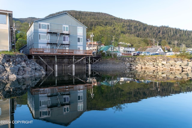 dock area featuring a deck with water view