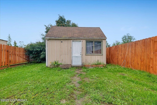 view of outdoor structure with a yard