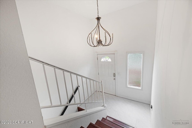 interior space with a towering ceiling and tile patterned floors