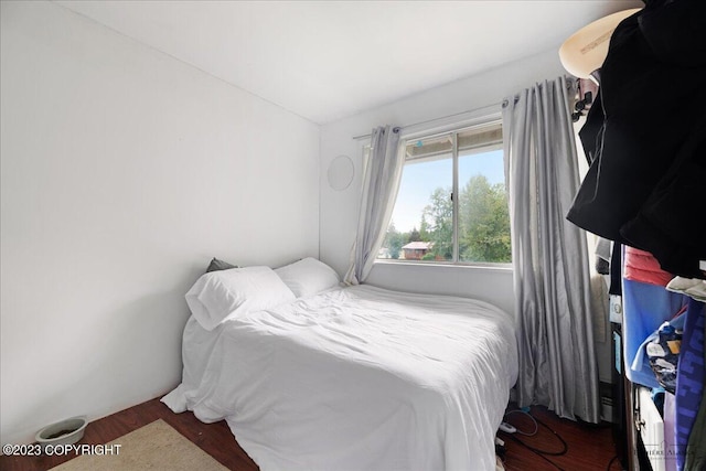 bedroom with hardwood / wood-style floors