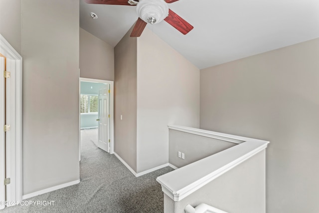 hall with lofted ceiling and carpet flooring