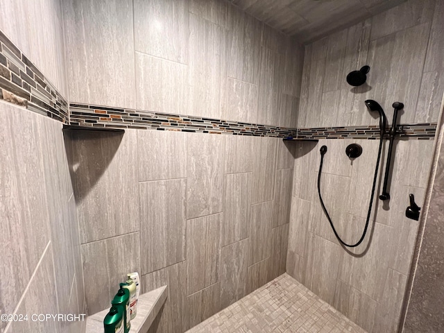 bathroom with a tile shower