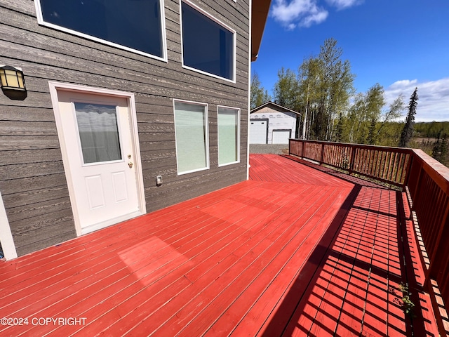 wooden terrace with an outdoor structure