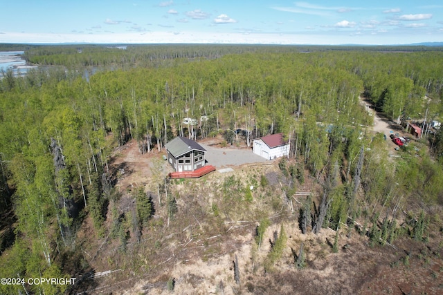 birds eye view of property with a wooded view