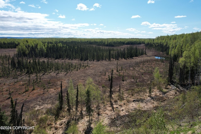 view of local wilderness with a view of trees