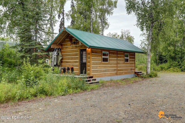 view of outdoor structure with driveway