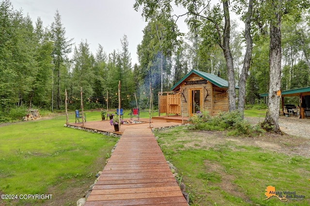 exterior space featuring a lawn and a deck