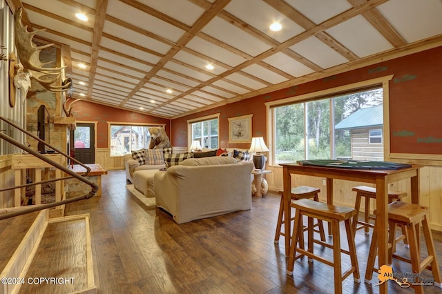 living room with plenty of natural light, beamed ceiling, dark wood-type flooring, and coffered ceiling