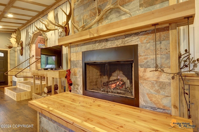 room details with beamed ceiling and hardwood / wood-style floors