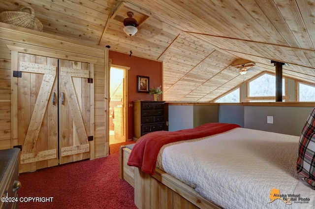 bedroom with carpet flooring, lofted ceiling, wood ceiling, and connected bathroom