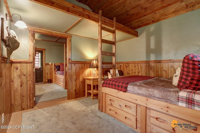 carpeted bedroom with beamed ceiling and wooden ceiling