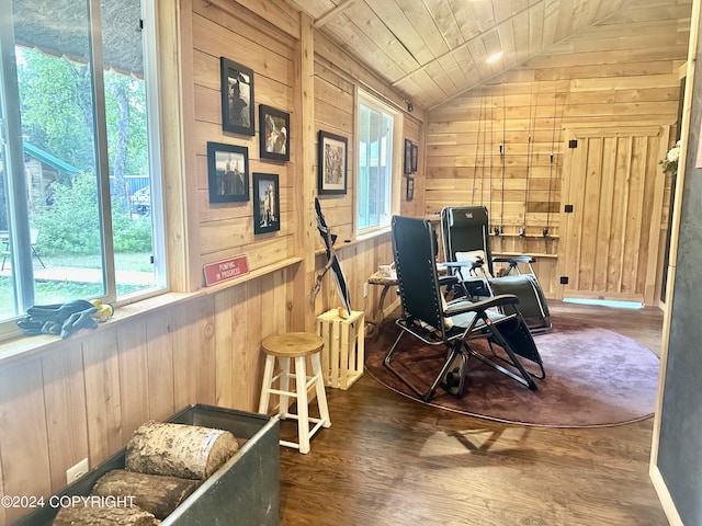 office space featuring lofted ceiling, wood ceiling, wooden walls, and wood finished floors