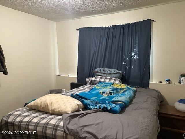 bedroom featuring a textured ceiling