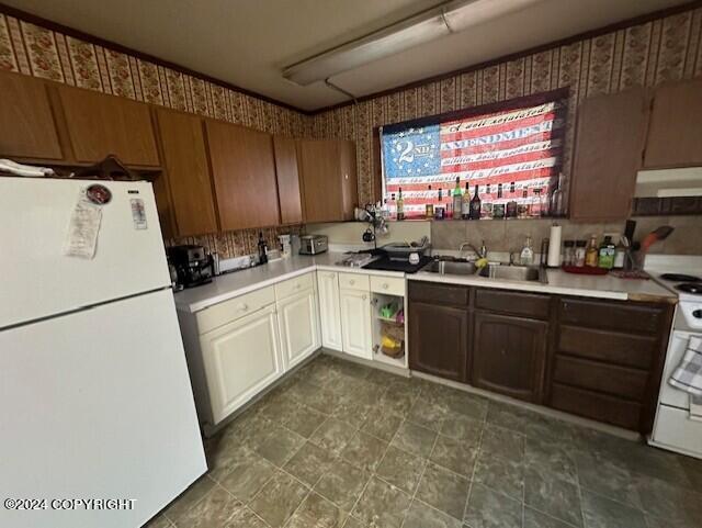 kitchen with white appliances and sink