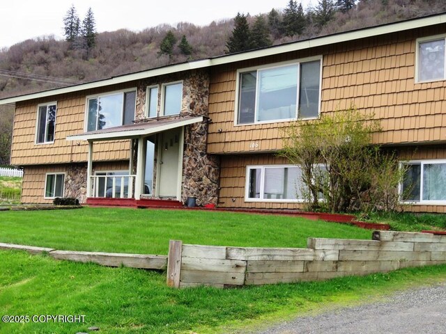 106 E Bayview Ave, Homer, AK 99603 - view of front of property featuring a front yard and stone siding