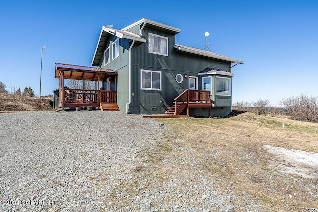 rear view of property with a deck