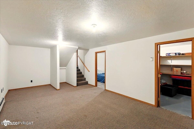 44775 Carver Dr, Kenai, AK 99611 - finished basement with carpet flooring, a textured ceiling, stairs, and baseboards