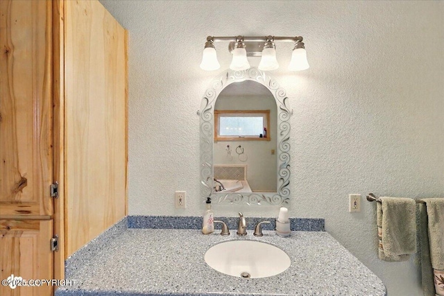 44775 Carver Dr, Kenai, AK 99611 - bathroom featuring vanity and a textured wall