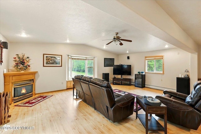 44775 Carver Dr, Kenai, AK 99611 - living room featuring a baseboard heating unit, healthy amount of natural light, light wood-style floors, lofted ceiling, and recessed lighting