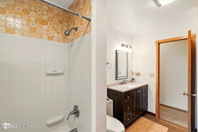 44775 Carver Dr, Kenai, AK 99611 - full bath with vanity, wood finished floors, and toilet