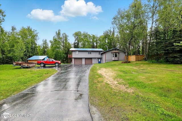 44775 Carver Dr, Kenai, AK 99611 - view of front of home with asphalt driveway and a garage