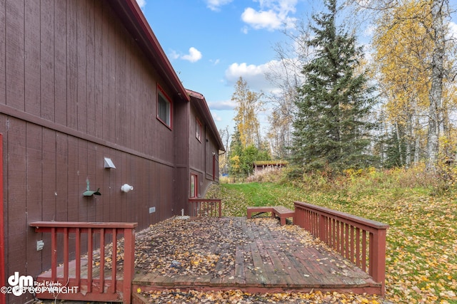 view of home's exterior with a wooden deck