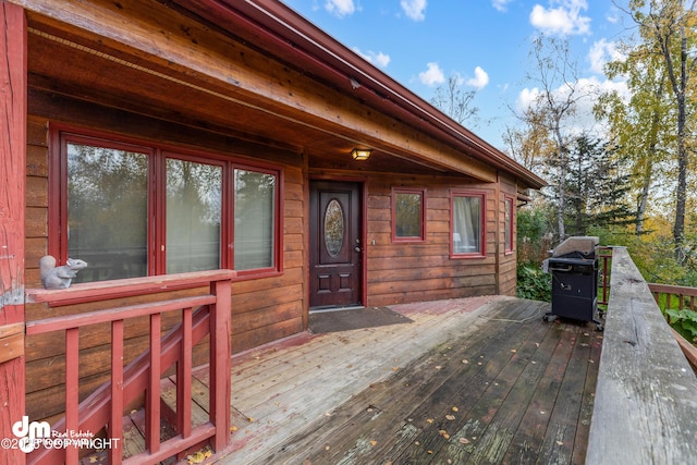 property entrance featuring a deck