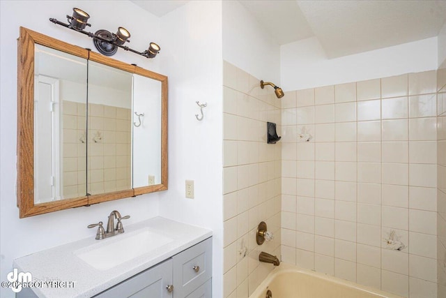 bathroom featuring bathtub / shower combination and vanity