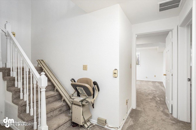 stairs featuring carpet flooring, visible vents, and baseboards