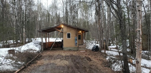 exterior space with a carport