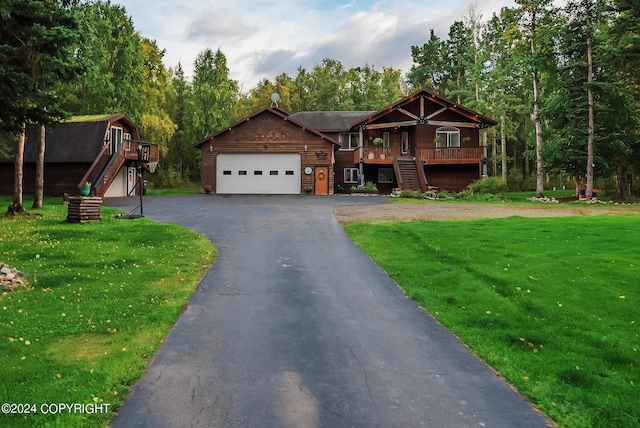 view of front of property featuring a garage and a front lawn