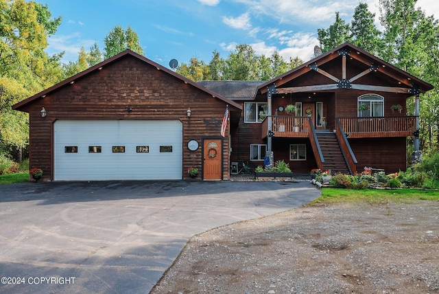 view of front of home featuring a garage and a porch