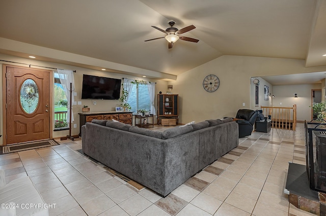 living room with vaulted ceiling, light tile patterned floors, and ceiling fan