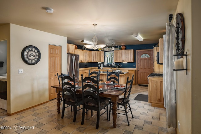 dining area featuring a chandelier