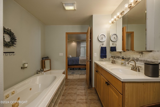 bathroom with vanity, tiled bath, and tile patterned floors