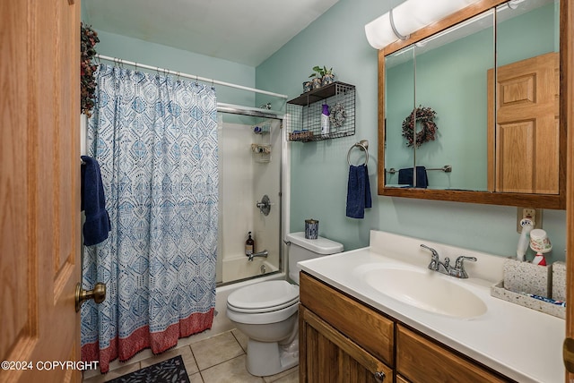 full bathroom featuring vanity, toilet, tile patterned flooring, and shower / bath combo with shower curtain