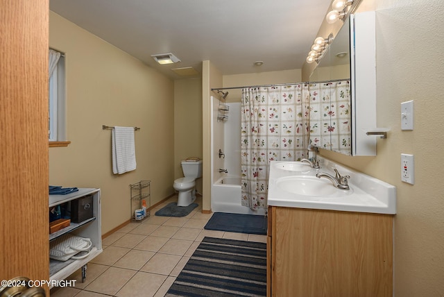 full bathroom featuring tile patterned floors, toilet, shower / bath combo with shower curtain, and vanity