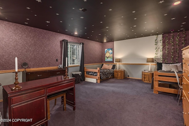 bedroom with dark colored carpet