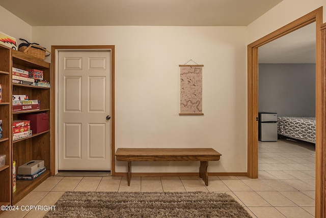 hallway with light tile patterned floors