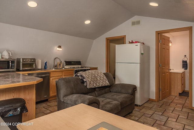 living room featuring lofted ceiling and sink