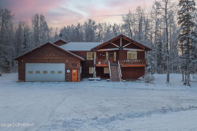 view of front of home with a garage and covered porch