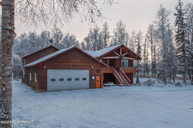 log home featuring a garage