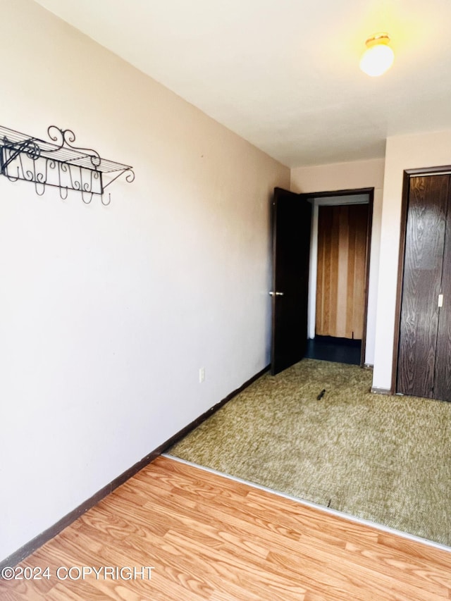 unfurnished bedroom with carpet and a closet